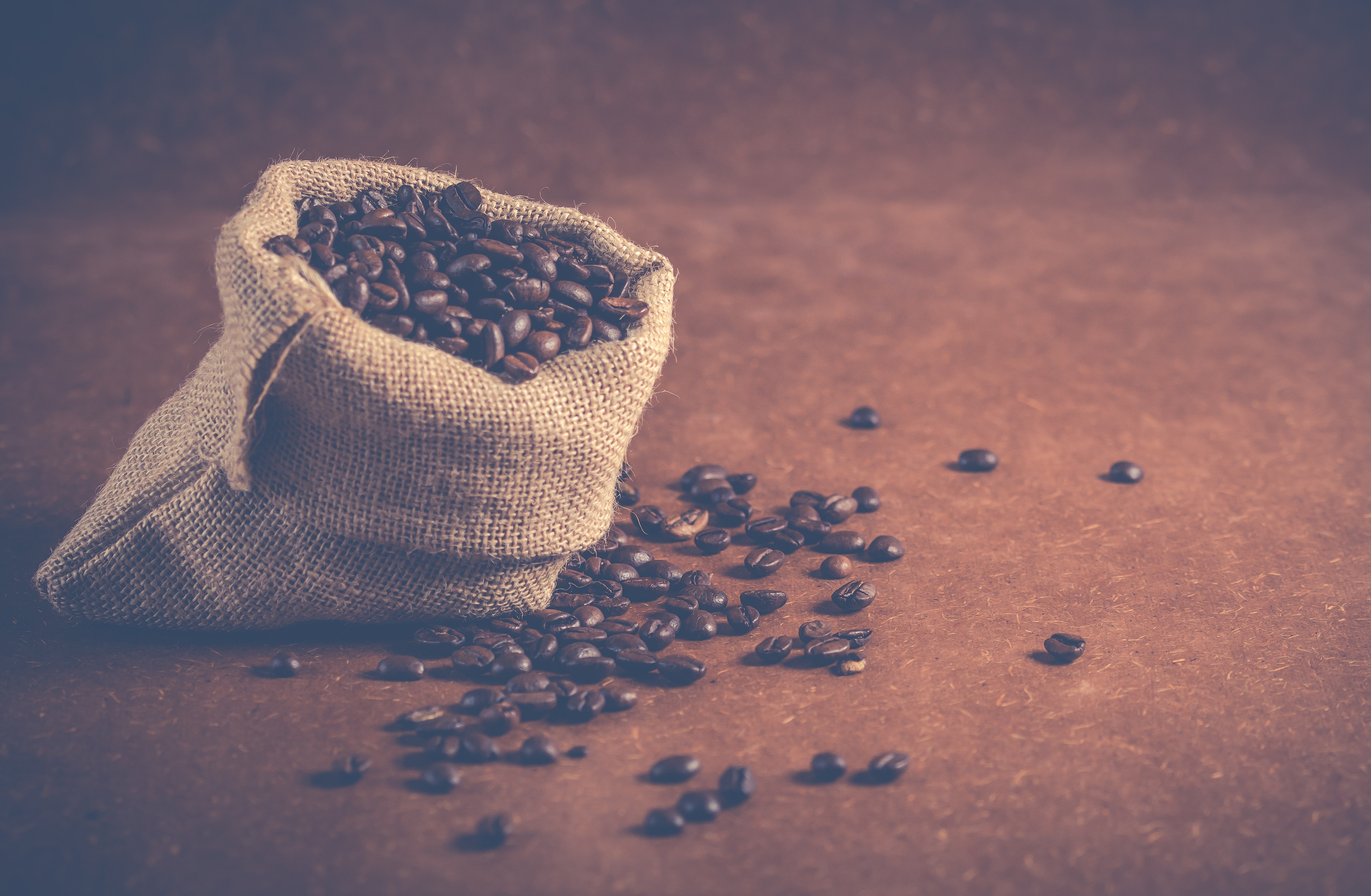 Coffee bean bag over flowing with beans that has already reach capacity. 
